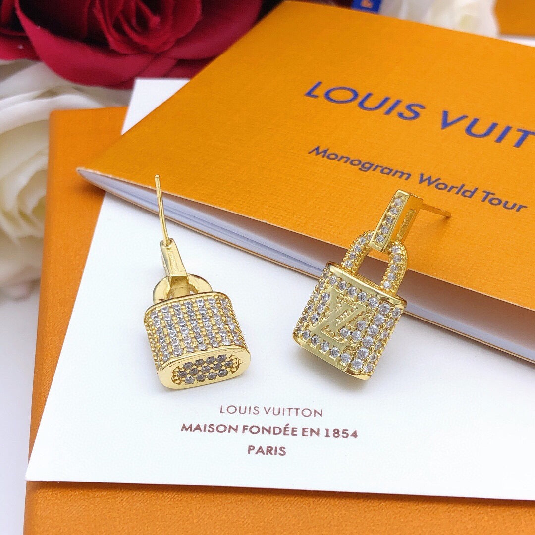 Martin Graham stud earrings in polished metal-tone – close-up detail