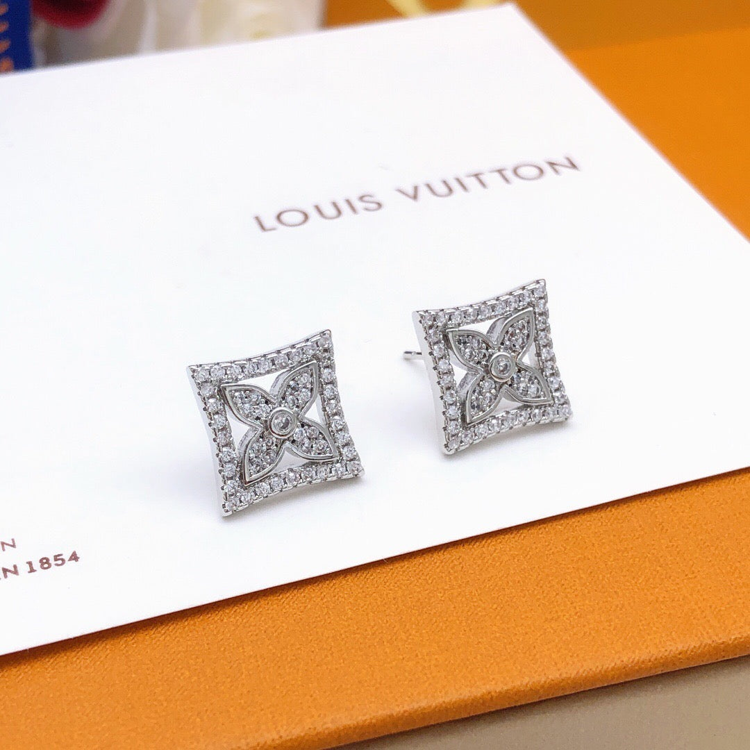 Martin Graham stud earrings in polished metal-tone – detail view