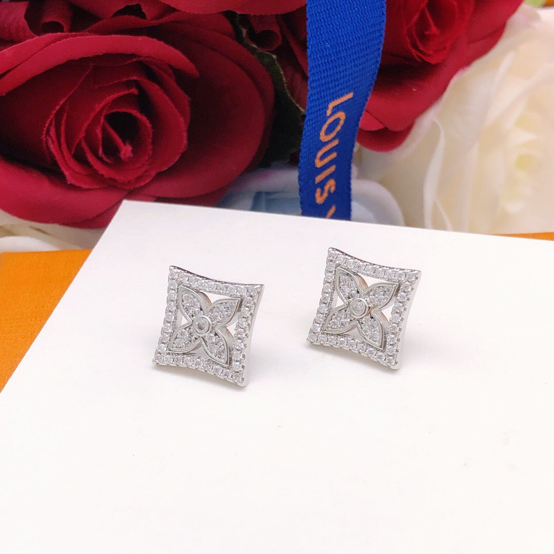 Martin Graham stud earrings in polished metal-tone – styled product view