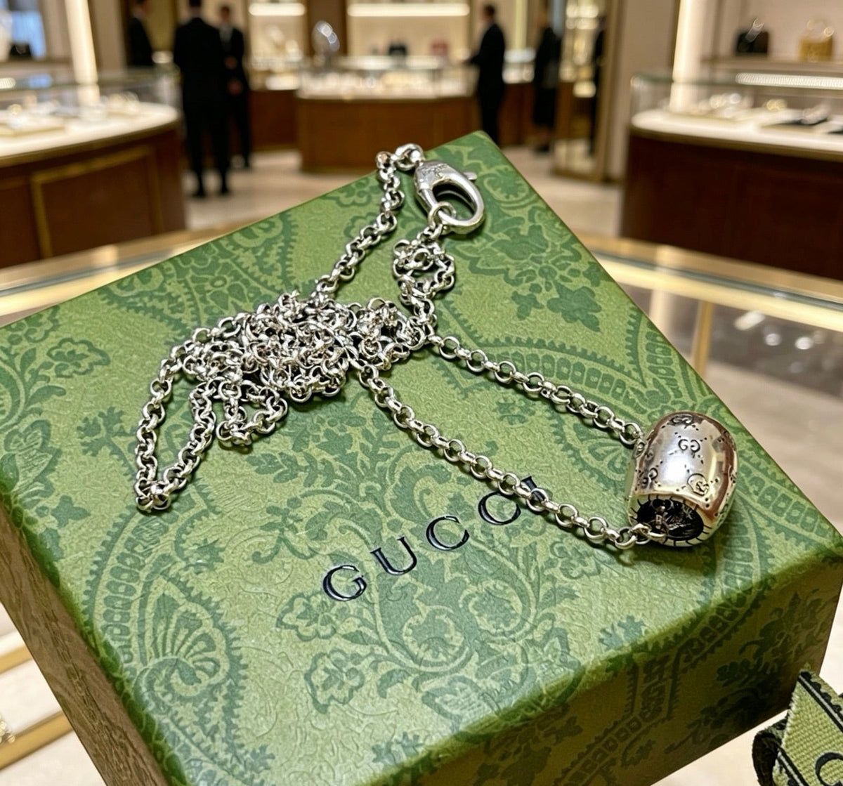 Martin Graham pendant necklace in polished metal-tone – close-up detail