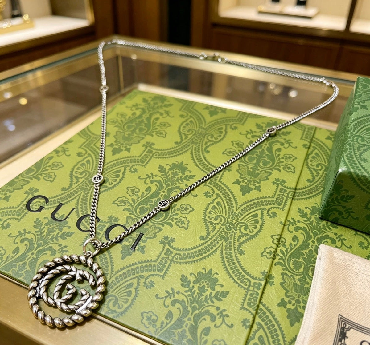 Martin Graham pendant necklace in polished metal-tone – styled product view