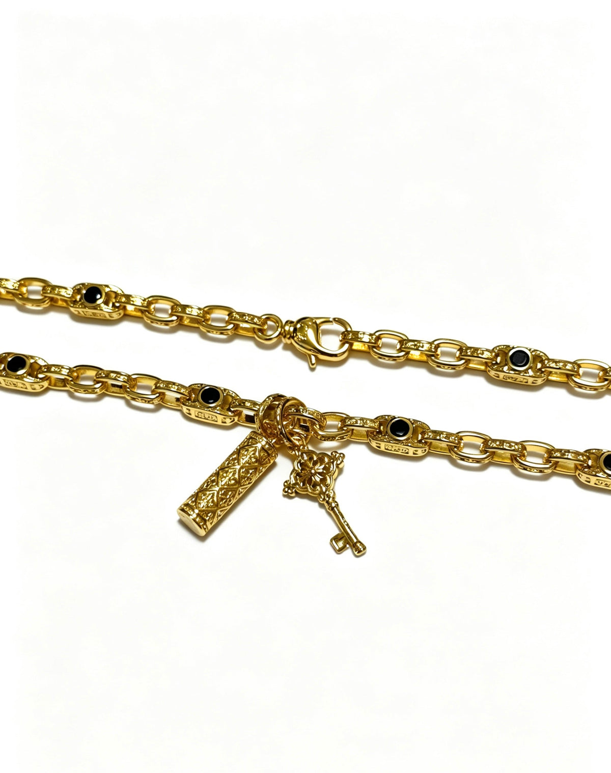 Martin Graham pendant necklace in polished metal-tone – close-up detail