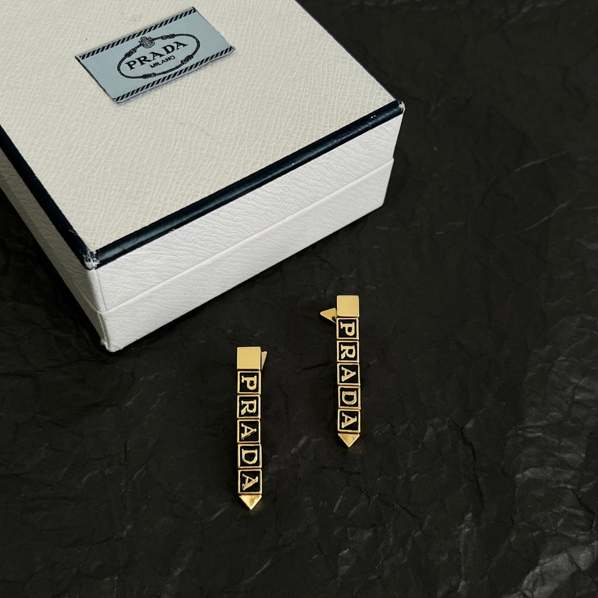 Martin Graham stud earrings in polished metal-tone – front view