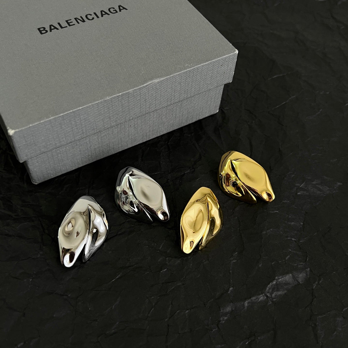 Martin Graham stud earrings in polished metal-tone – styled product view
