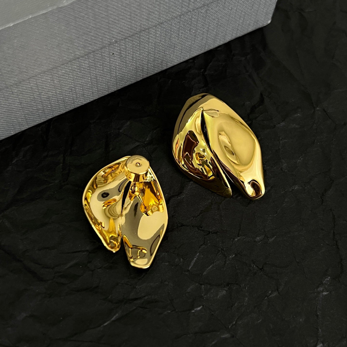 Martin Graham stud earrings in polished metal-tone – front product view