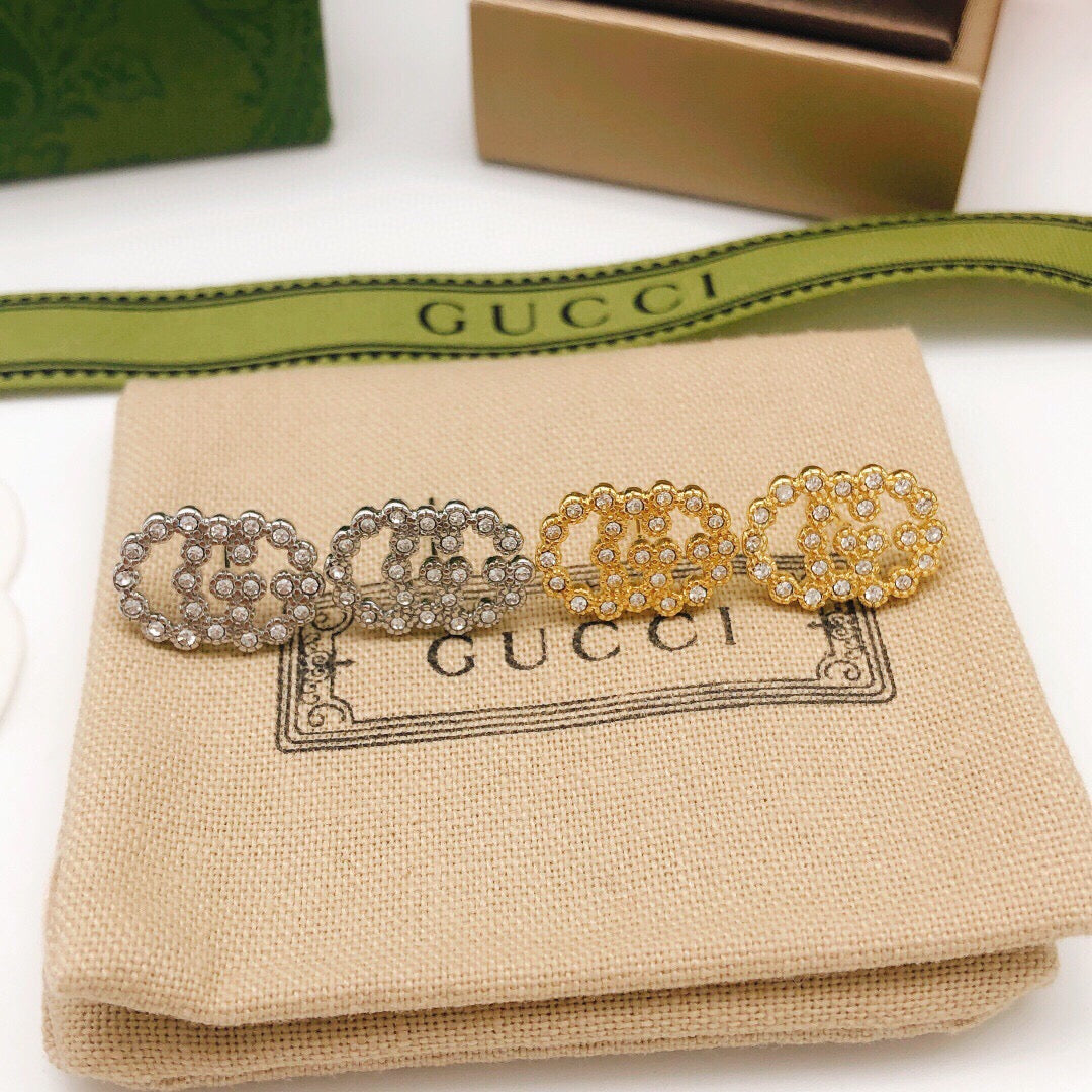 Martin Graham stud earrings in polished metal-tone – styled product view