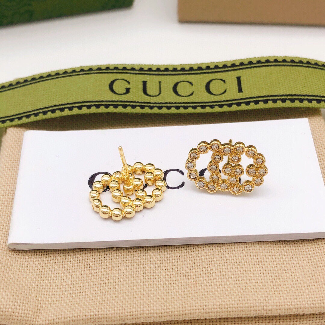 Martin Graham stud earrings in polished metal-tone – front product view