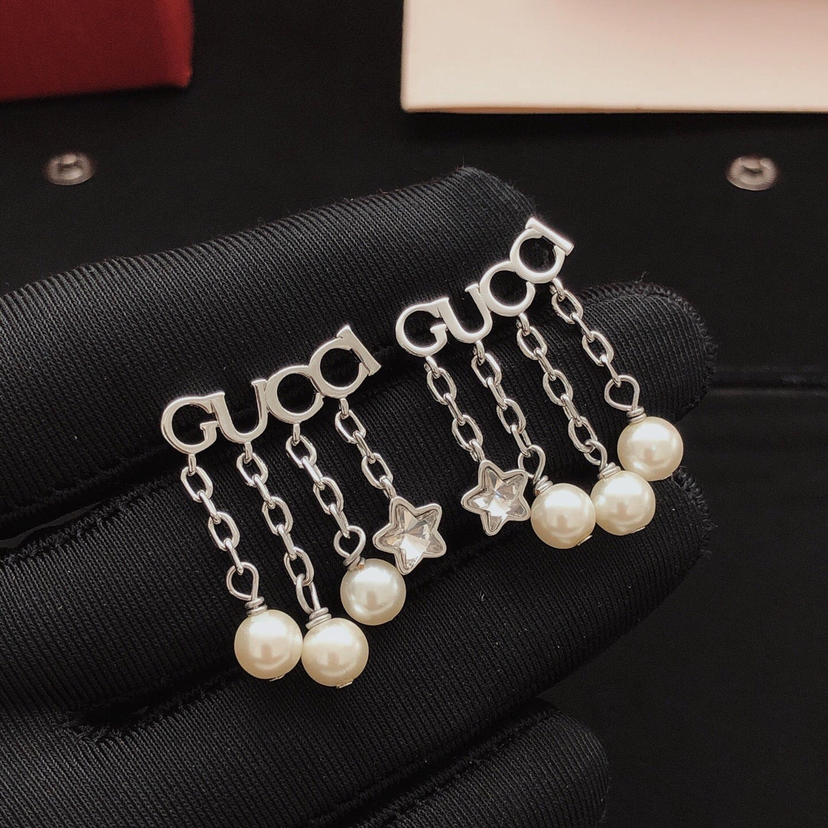 Martin Graham stud earrings in polished metal-tone – front product view