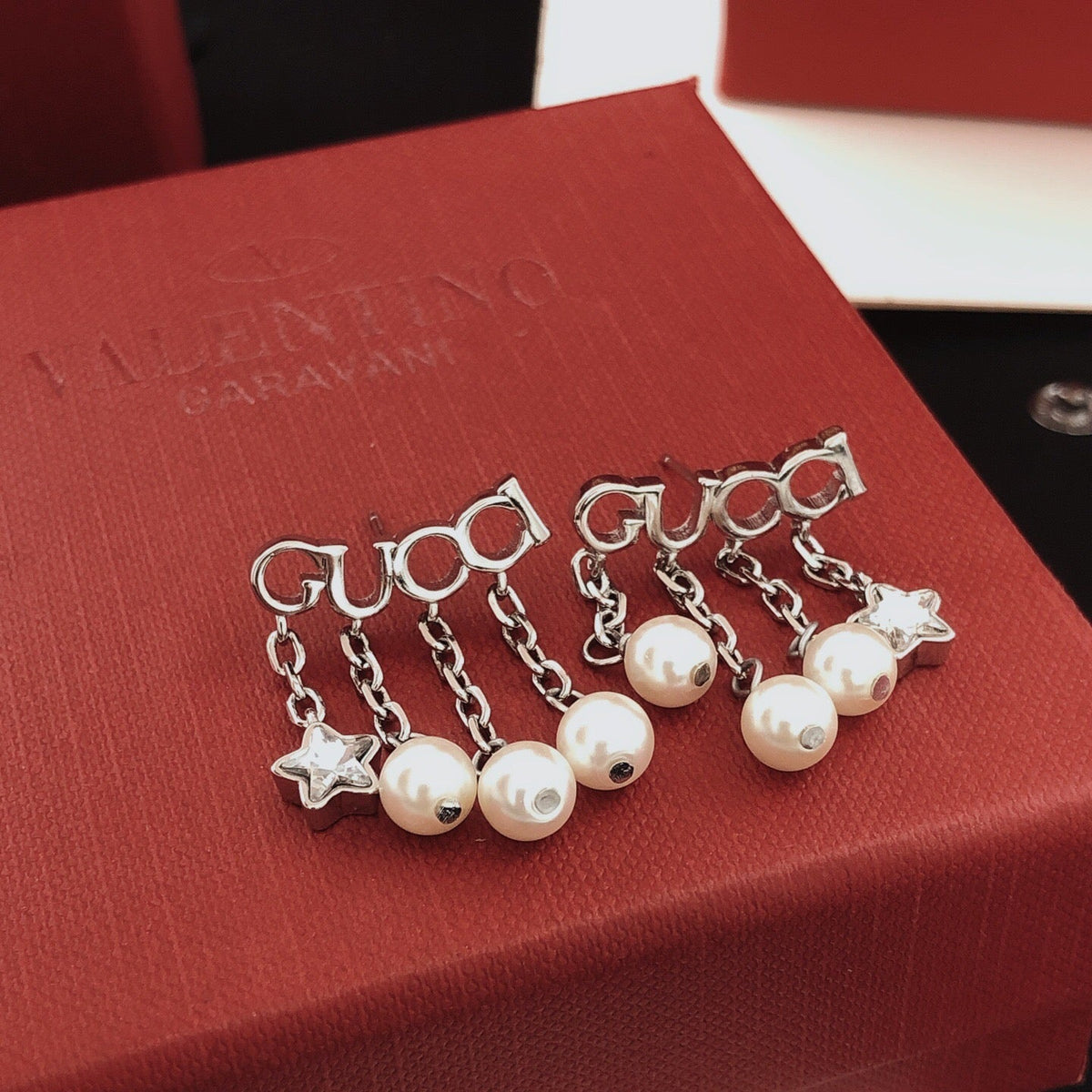 Martin Graham stud earrings in polished metal-tone – styled product view