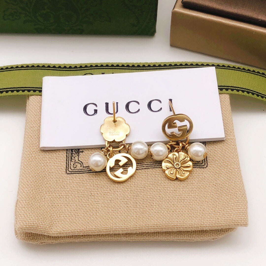 Martin Graham stud earrings in polished metal-tone – detail view