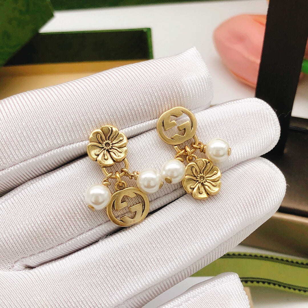 Martin Graham stud earrings in polished metal-tone – front product view