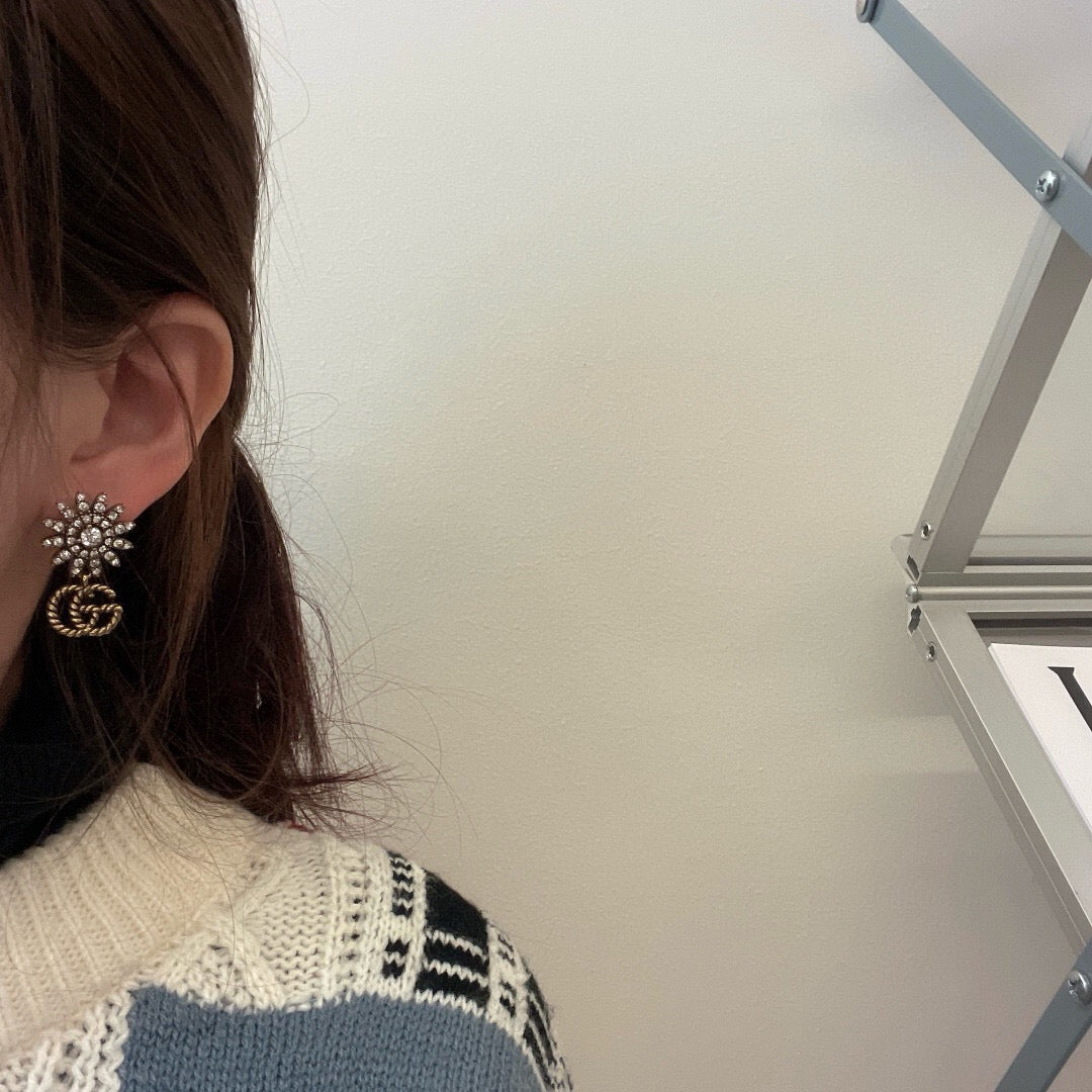Martin Graham stud earrings in polished metal-tone – side detail