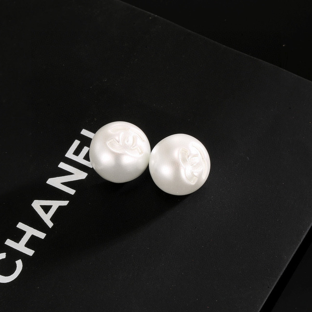 Martin Graham stud earrings in polished metal-tone – front product view