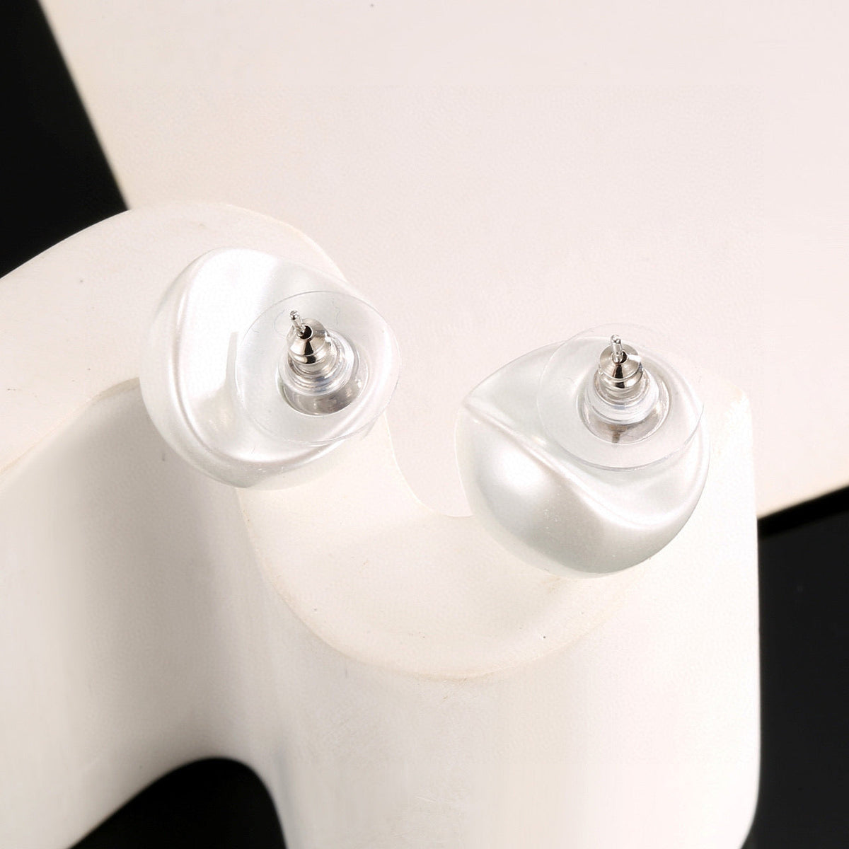 Martin Graham stud earrings in polished metal-tone – main product view