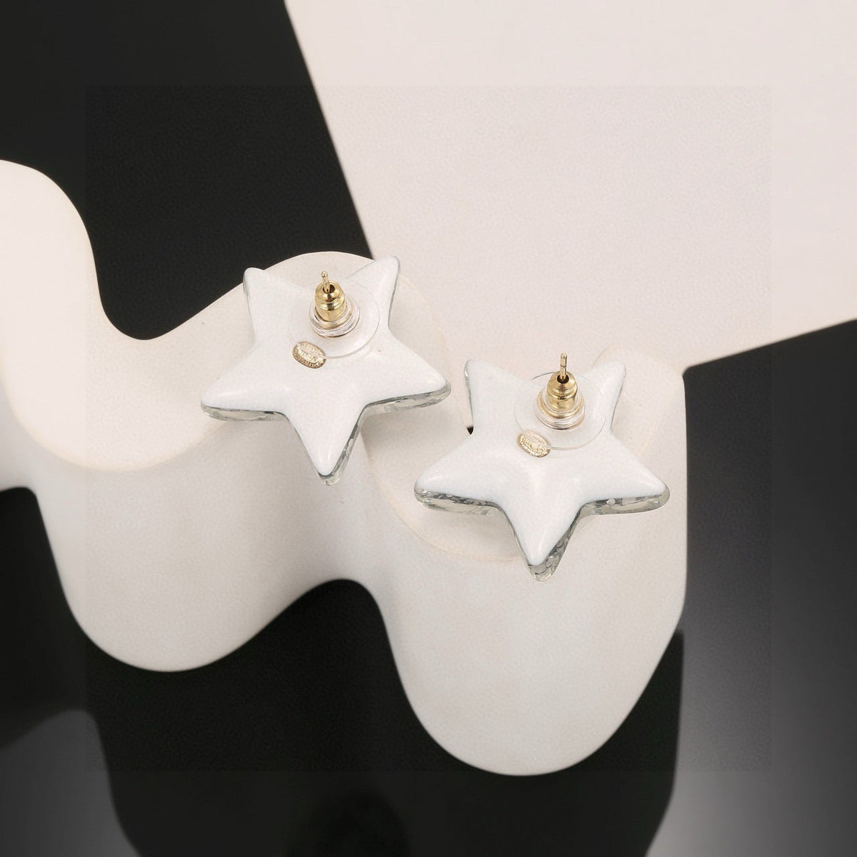 Martin Graham stud earrings in polished metal-tone – styled product view