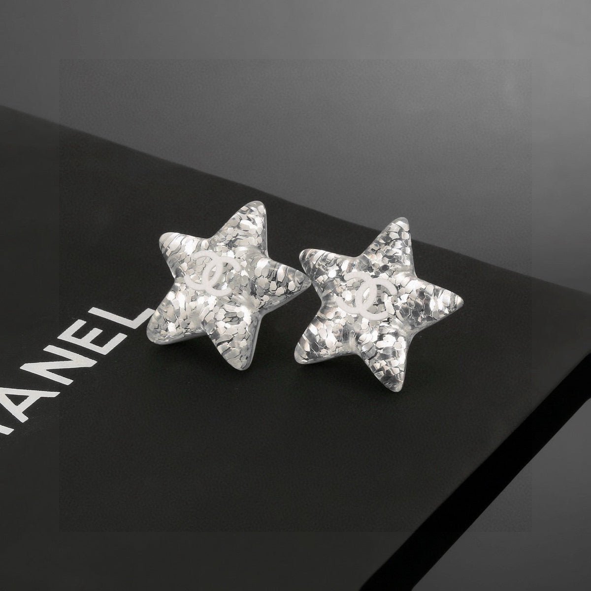 Martin Graham stud earrings in polished metal-tone – side detail