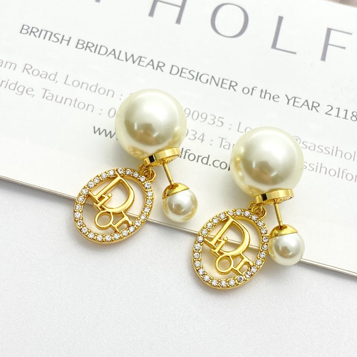 Martin Graham stud earrings in polished metal-tone – front view