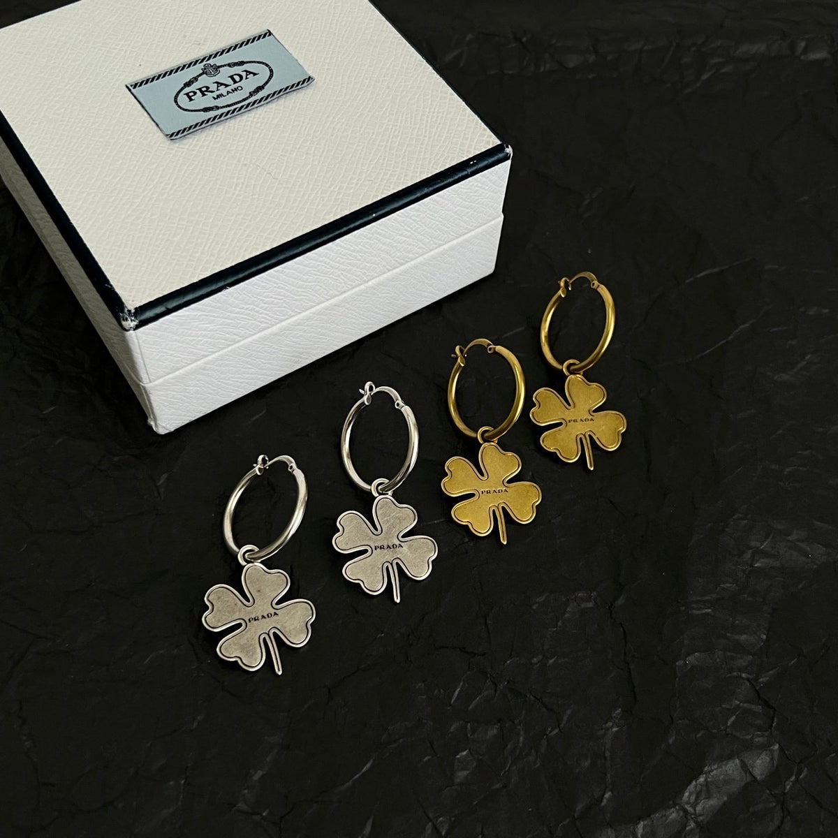 Martin Graham earrings in polished metal-tone