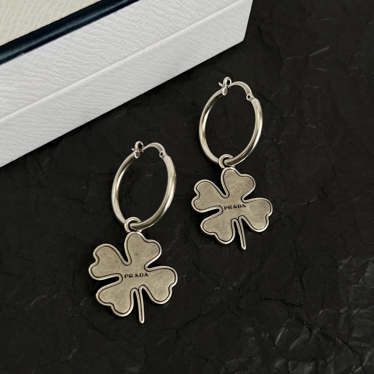 Martin Graham earrings in polished metal-tone – front view