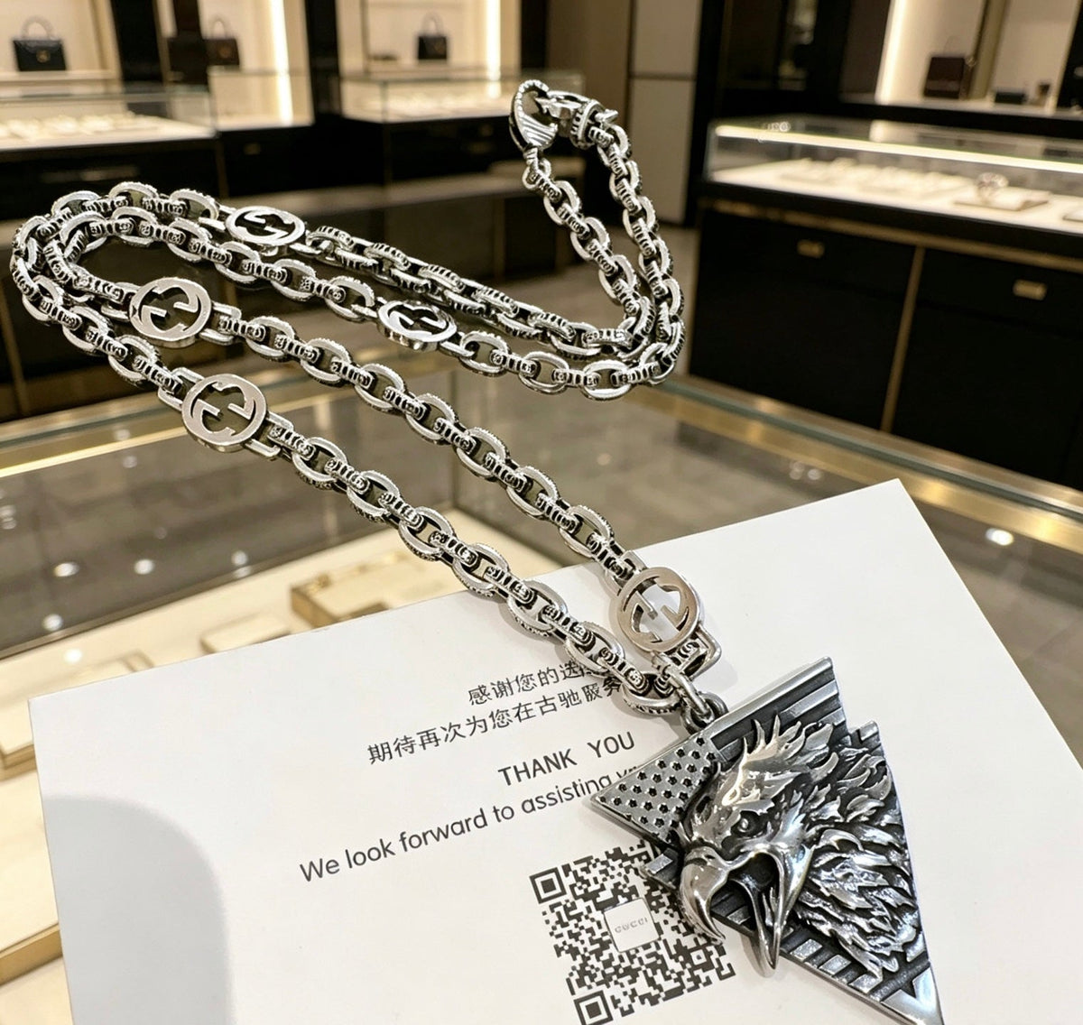 Martin Graham pendant necklace in polished metal-tone – detail view