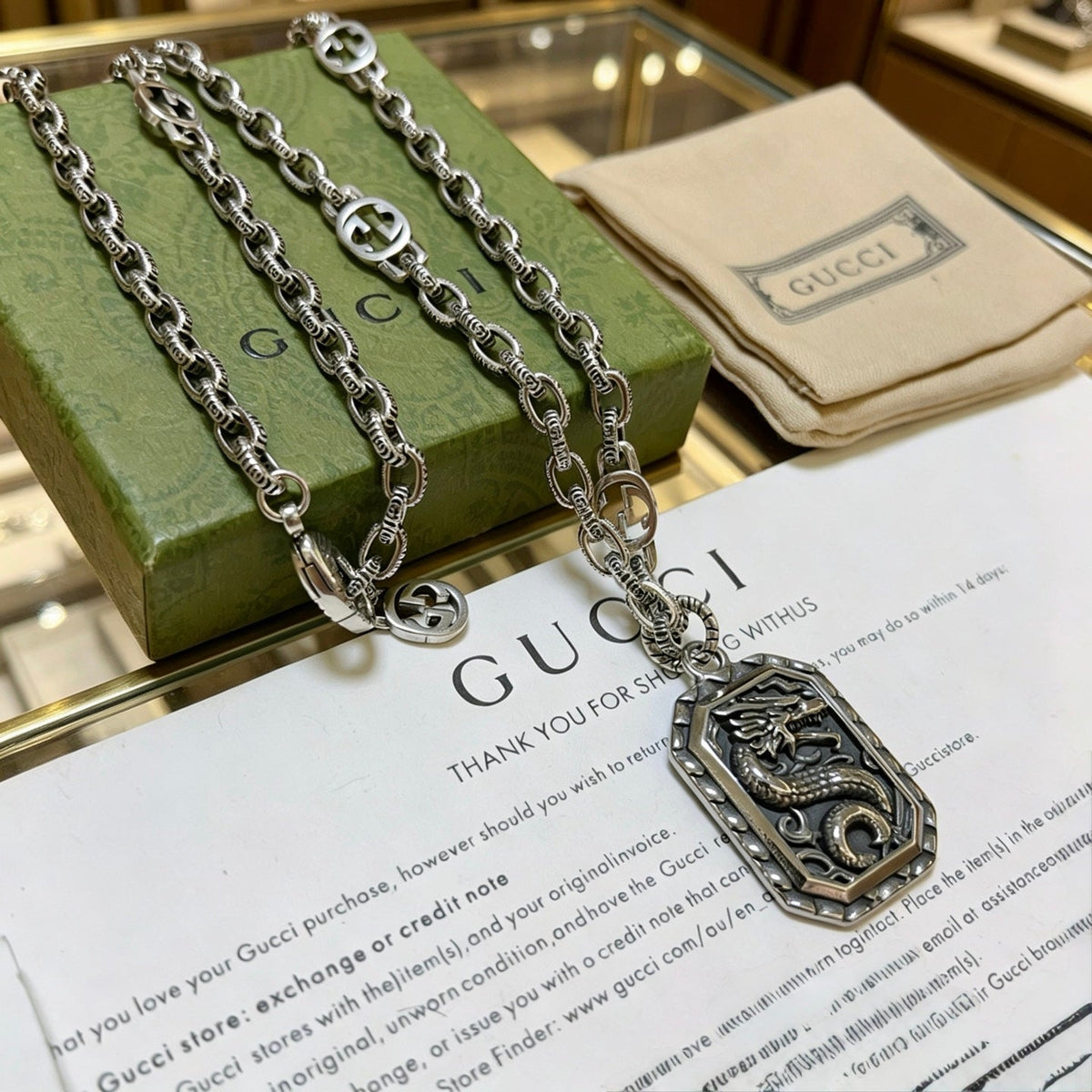 Martin Graham pendant necklace in polished metal-tone – side detail