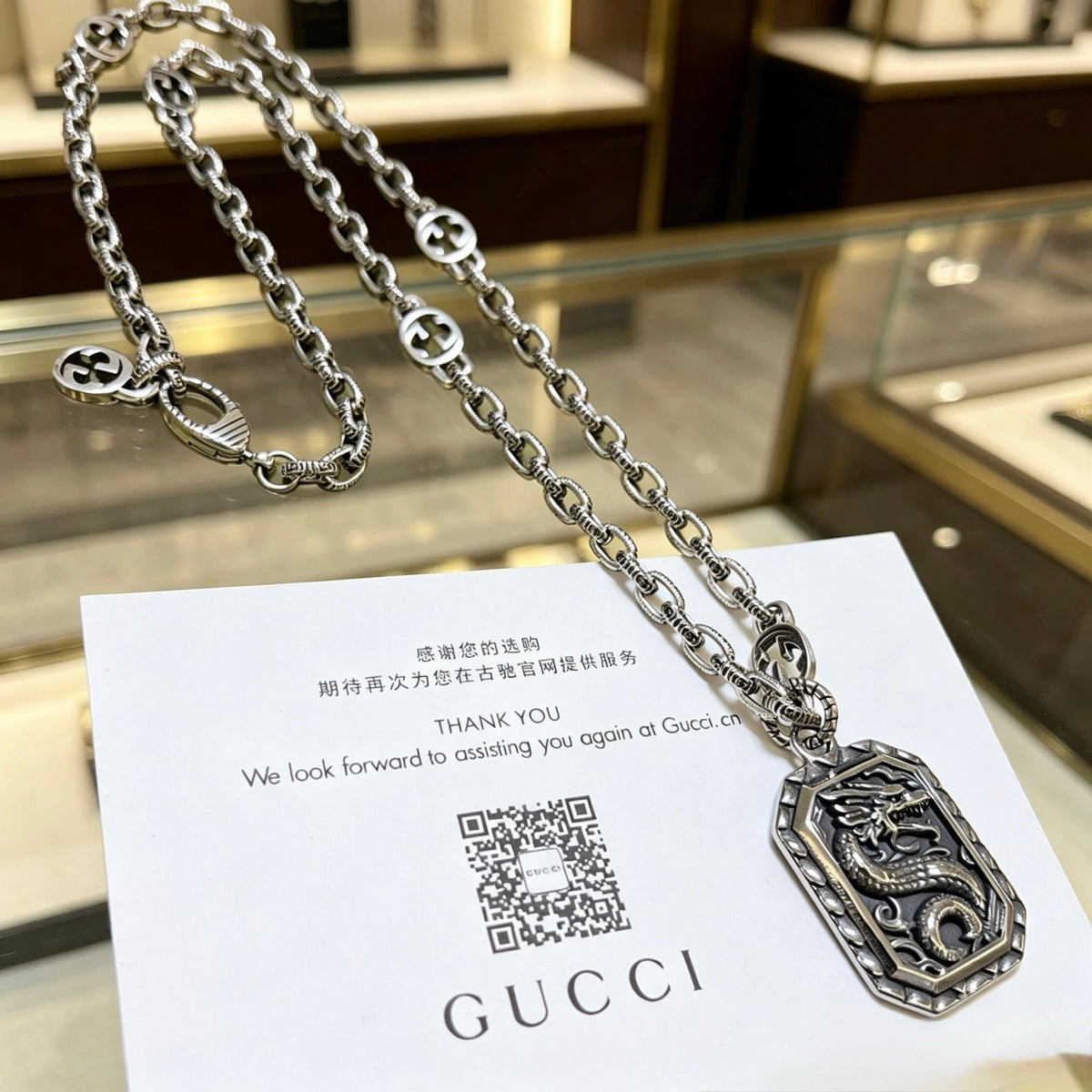 Martin Graham pendant necklace in polished metal-tone – detail view