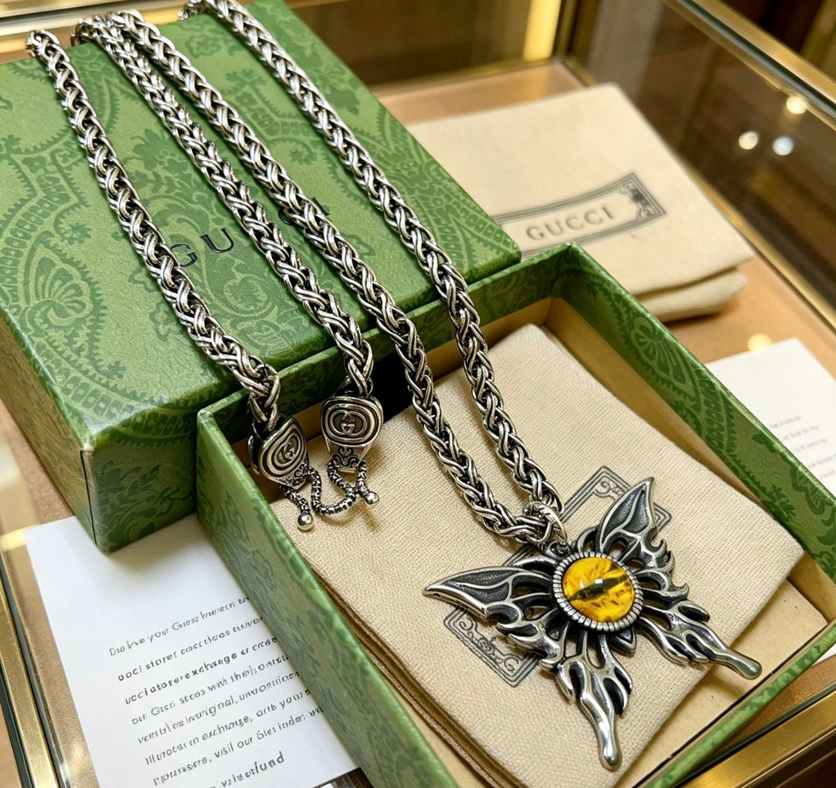 Martin Graham pendant necklace in polished metal-tone – close-up detail