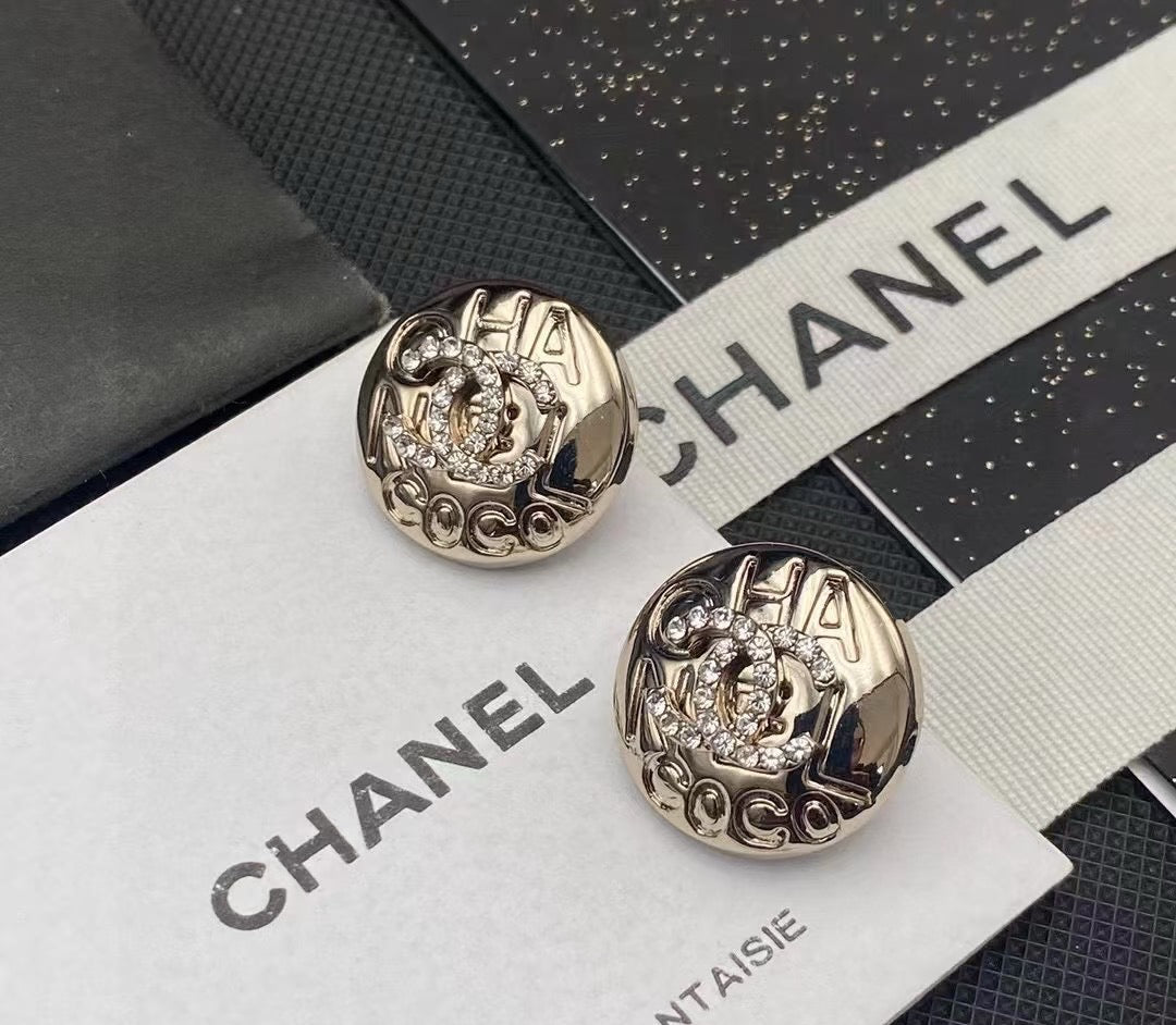 Martin Graham stud earrings in polished metal-tone – front product view
