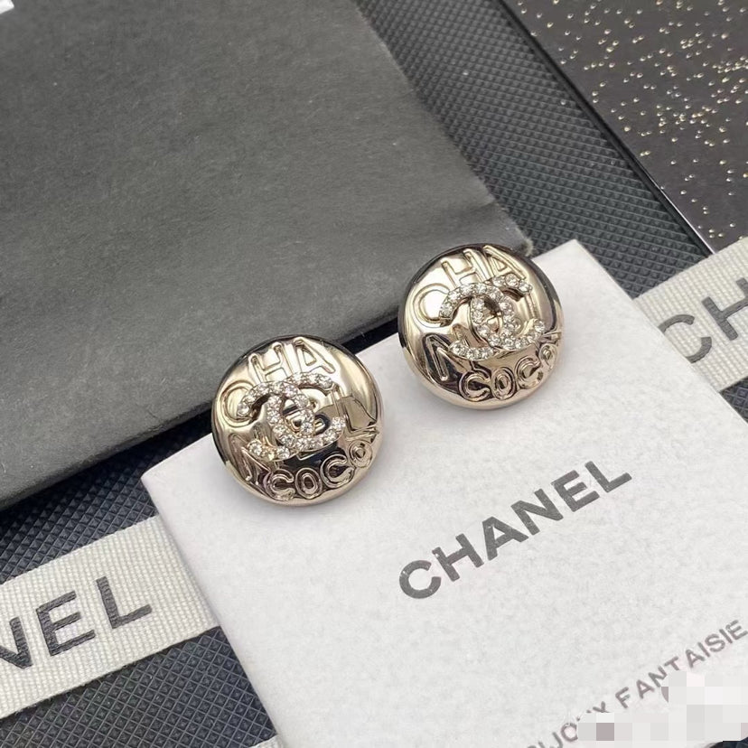 Martin Graham stud earrings in polished metal-tone – detail view