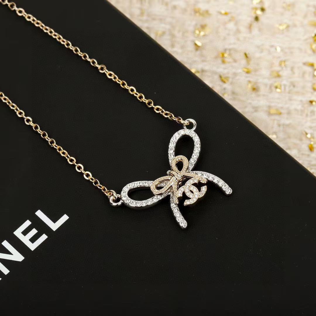 Martin Graham pendant necklace in polished metal-tone – close-up detail