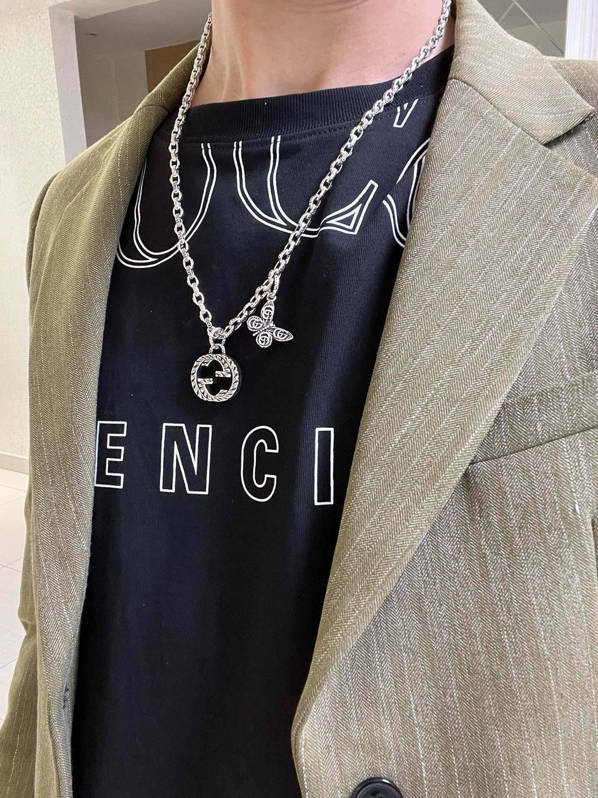 Martin Graham pendant necklace in polished metal-tone – detail view