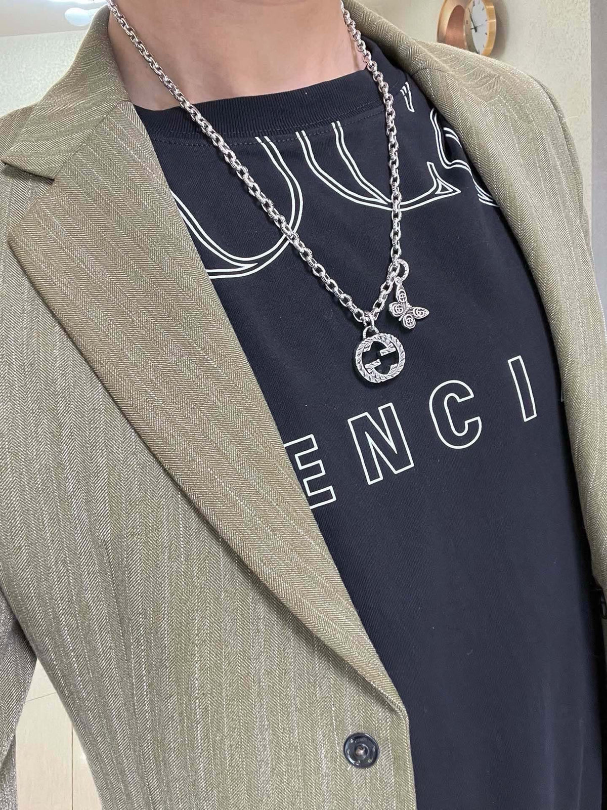 Martin Graham pendant necklace in polished metal-tone – side detail