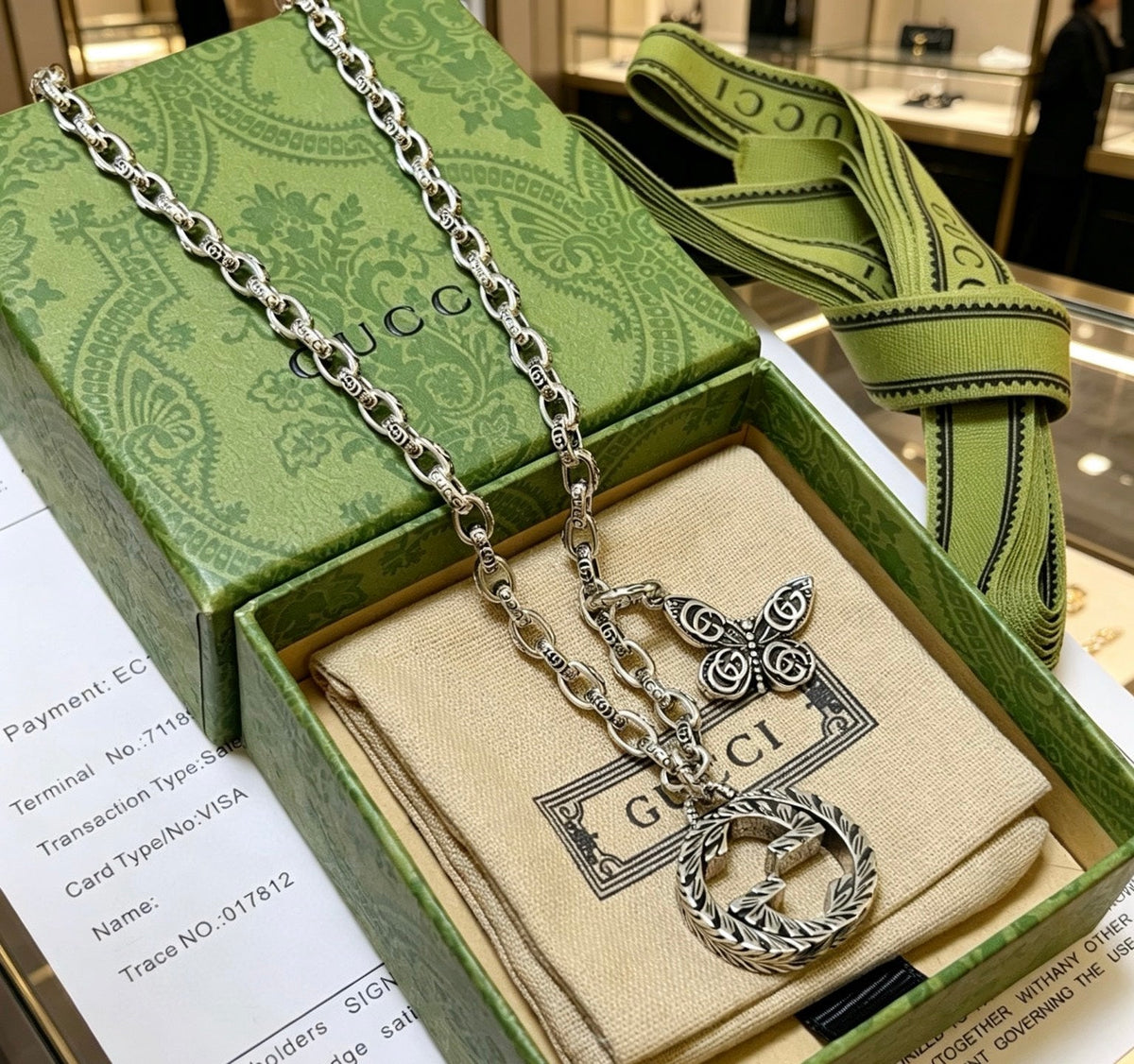 Martin Graham pendant necklace in polished metal-tone – close-up detail