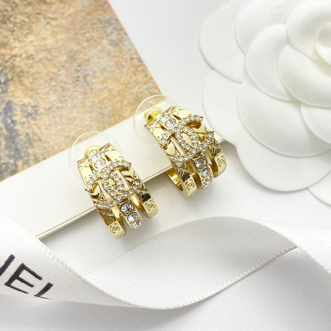 Martin Graham stud earrings in polished metal-tone – main product view