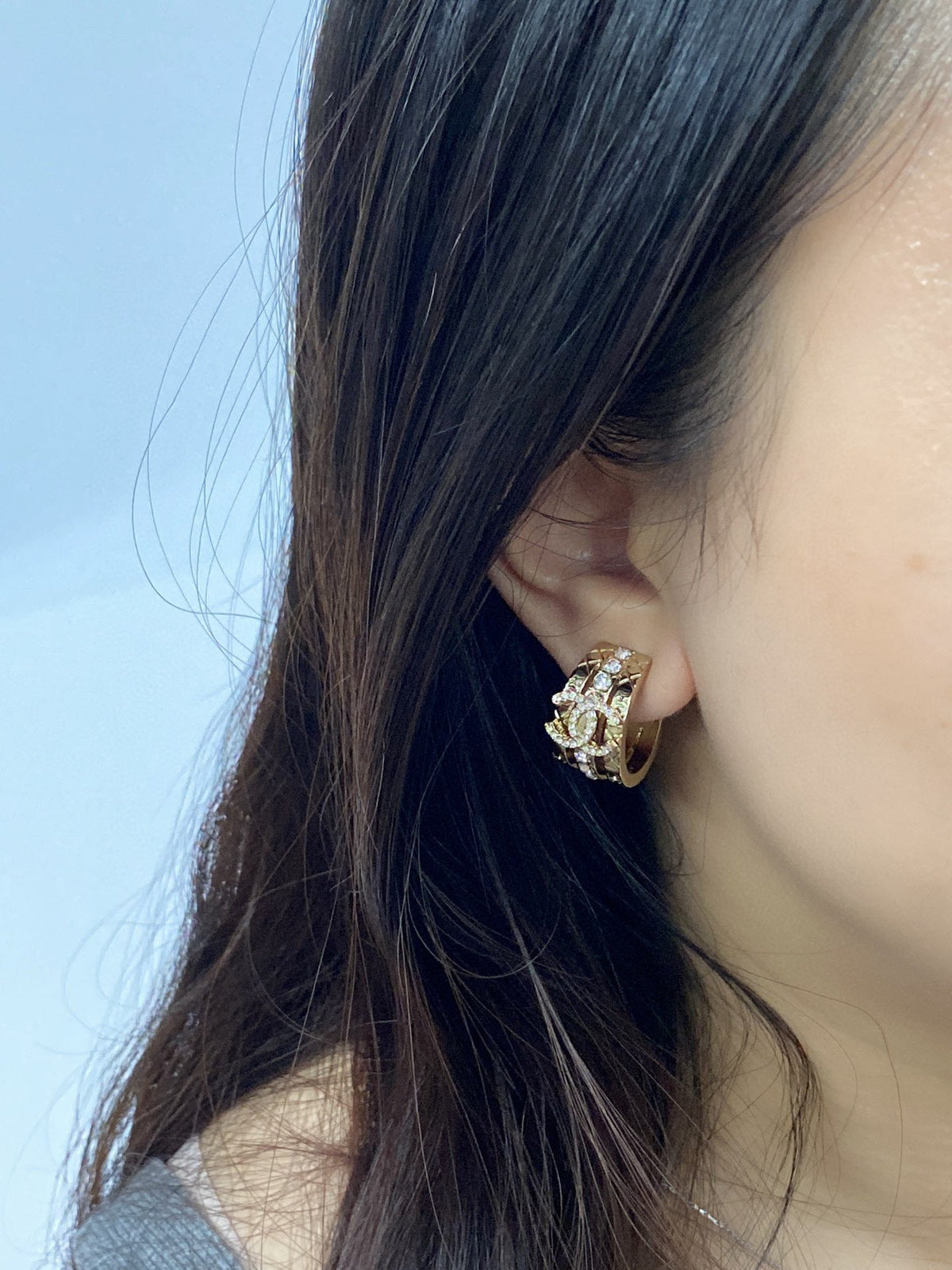 Martin Graham stud earrings in polished metal-tone – side detail