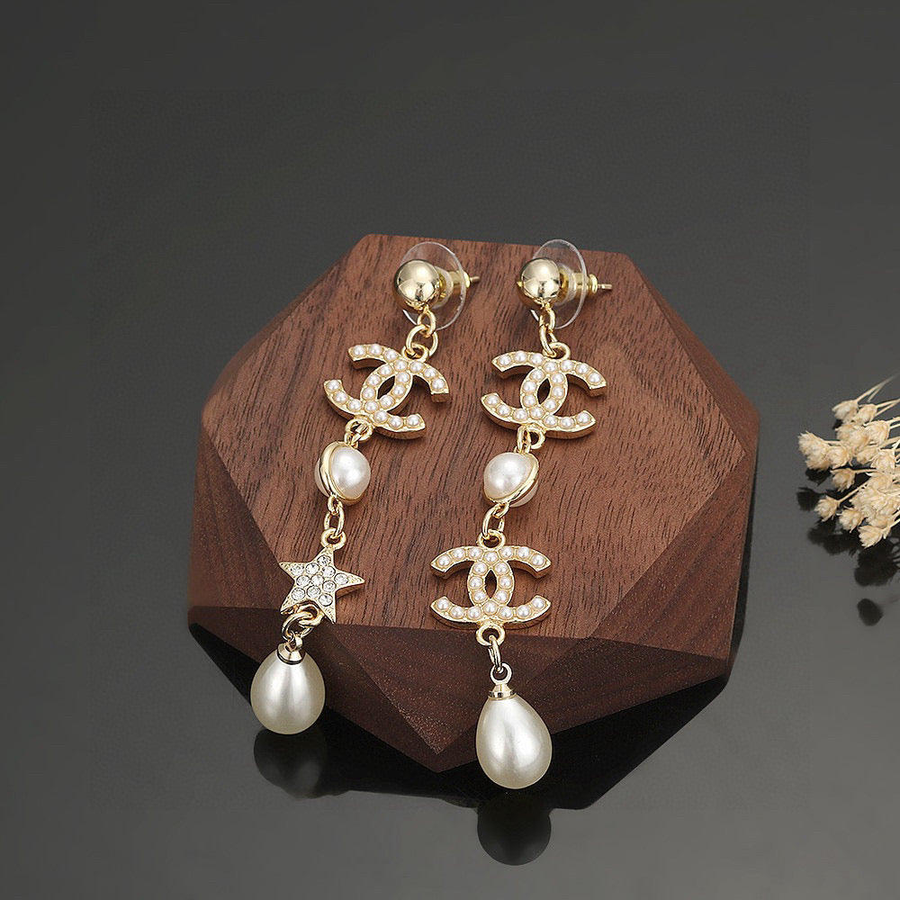 Martin Graham stud earrings in polished metal-tone – front product view