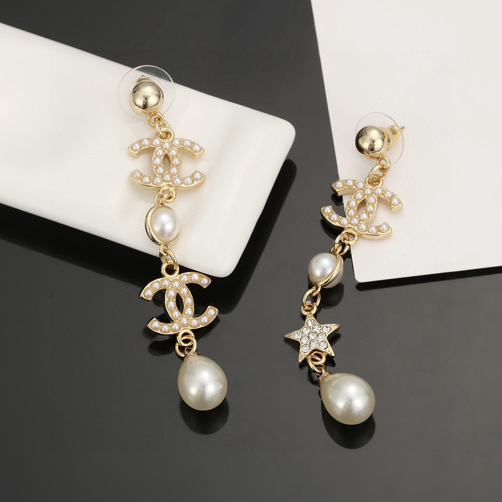 Martin Graham stud earrings in polished metal-tone – detail view
