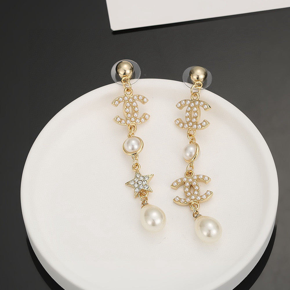 Martin Graham stud earrings in polished metal-tone – styled product view