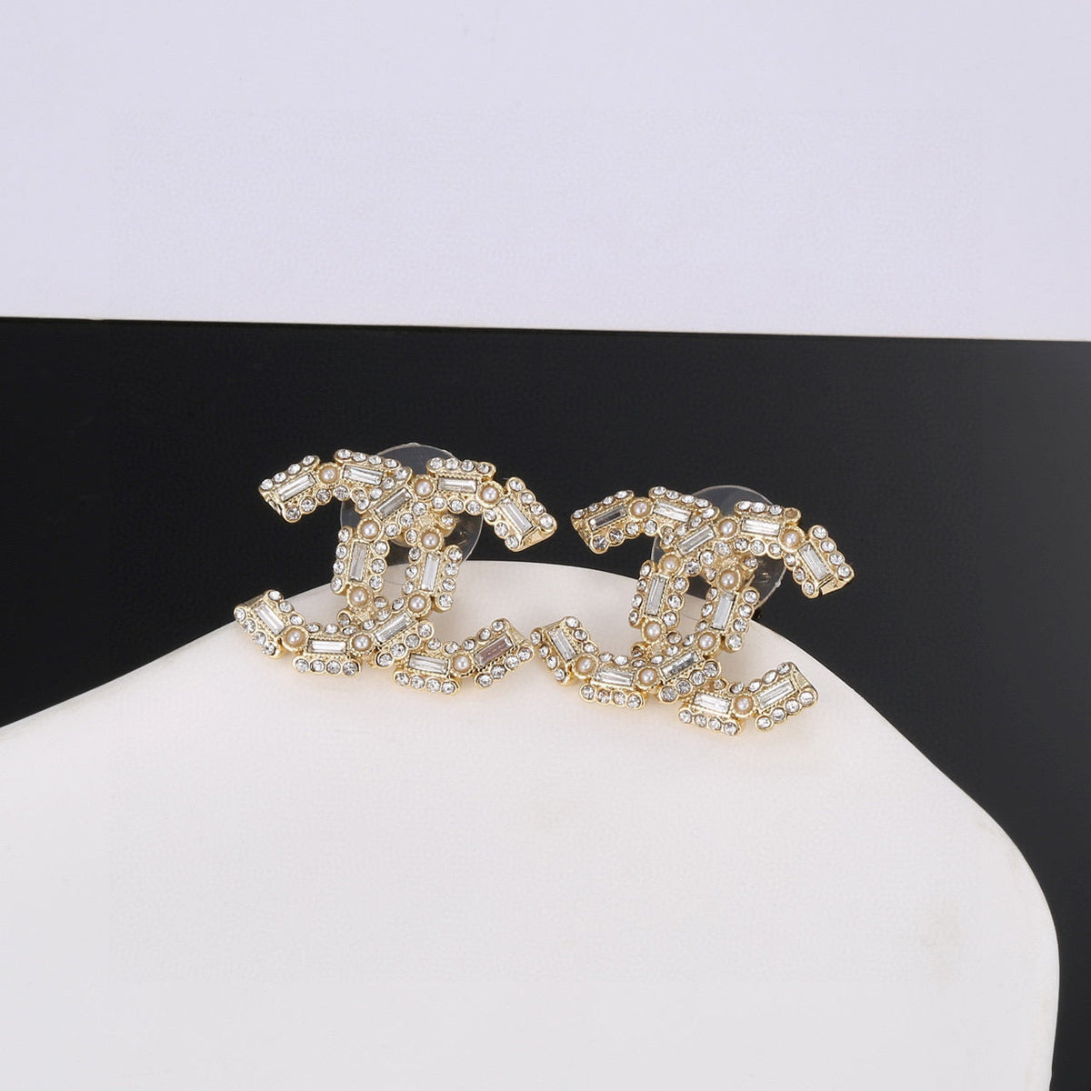 Martin Graham stud earrings in polished metal-tone – front product view