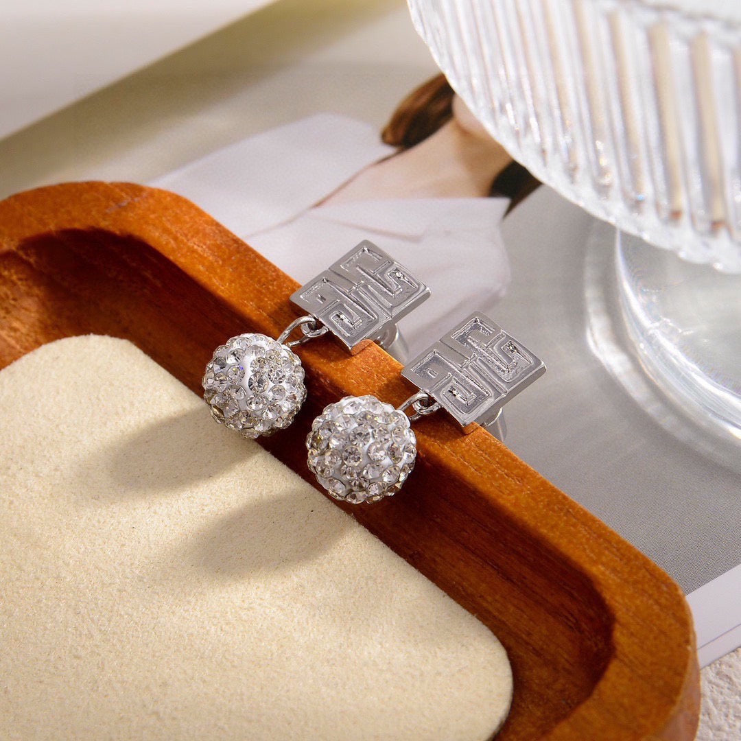Martin Graham stud earrings in polished metal-tone – front product view