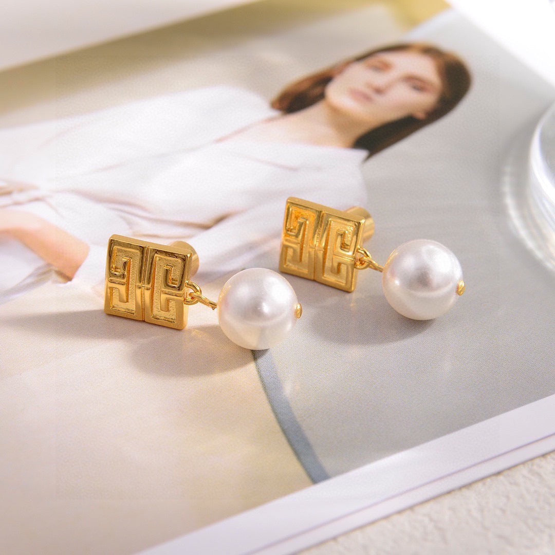 Martin Graham stud earrings in polished metal-tone – styled product view