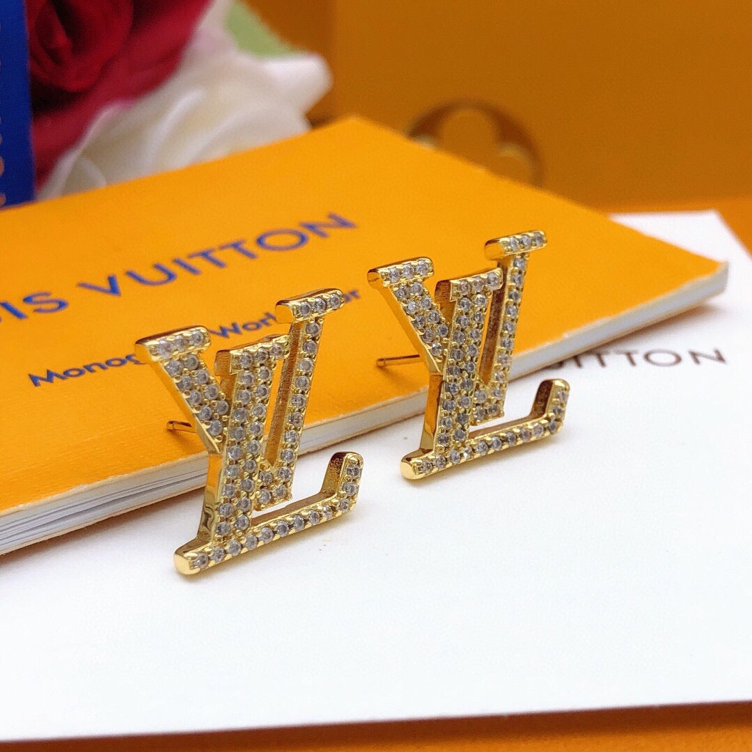 Martin Graham stud earrings in polished metal-tone – detail view