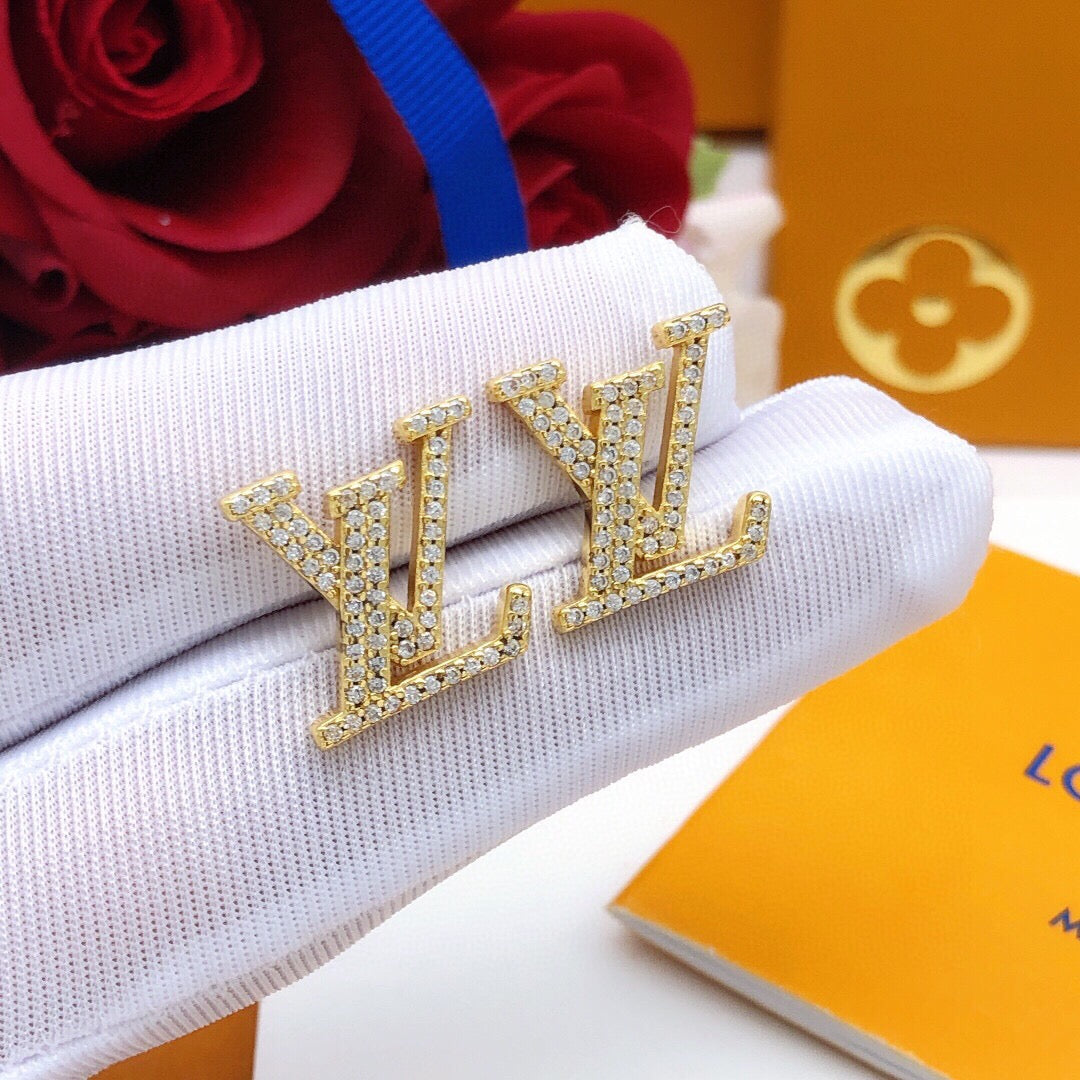 Martin Graham stud earrings in polished metal-tone – styled product view