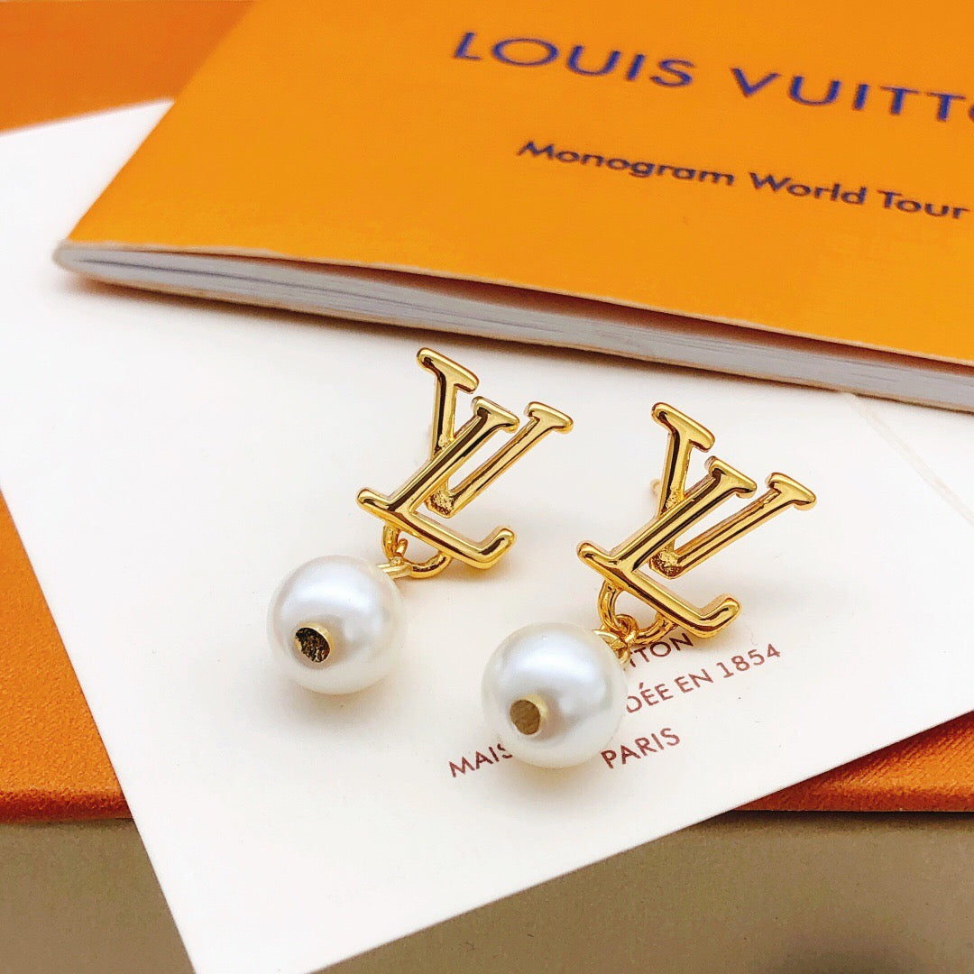 Martin Graham stud earrings in polished metal-tone – detail view