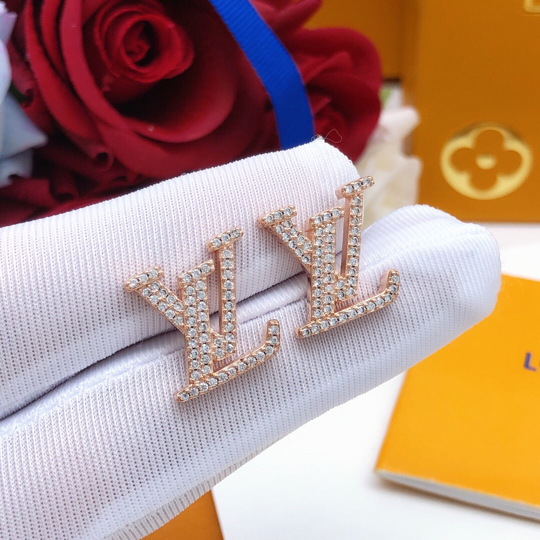 Martin Graham stud earrings in polished metal-tone – close-up detail