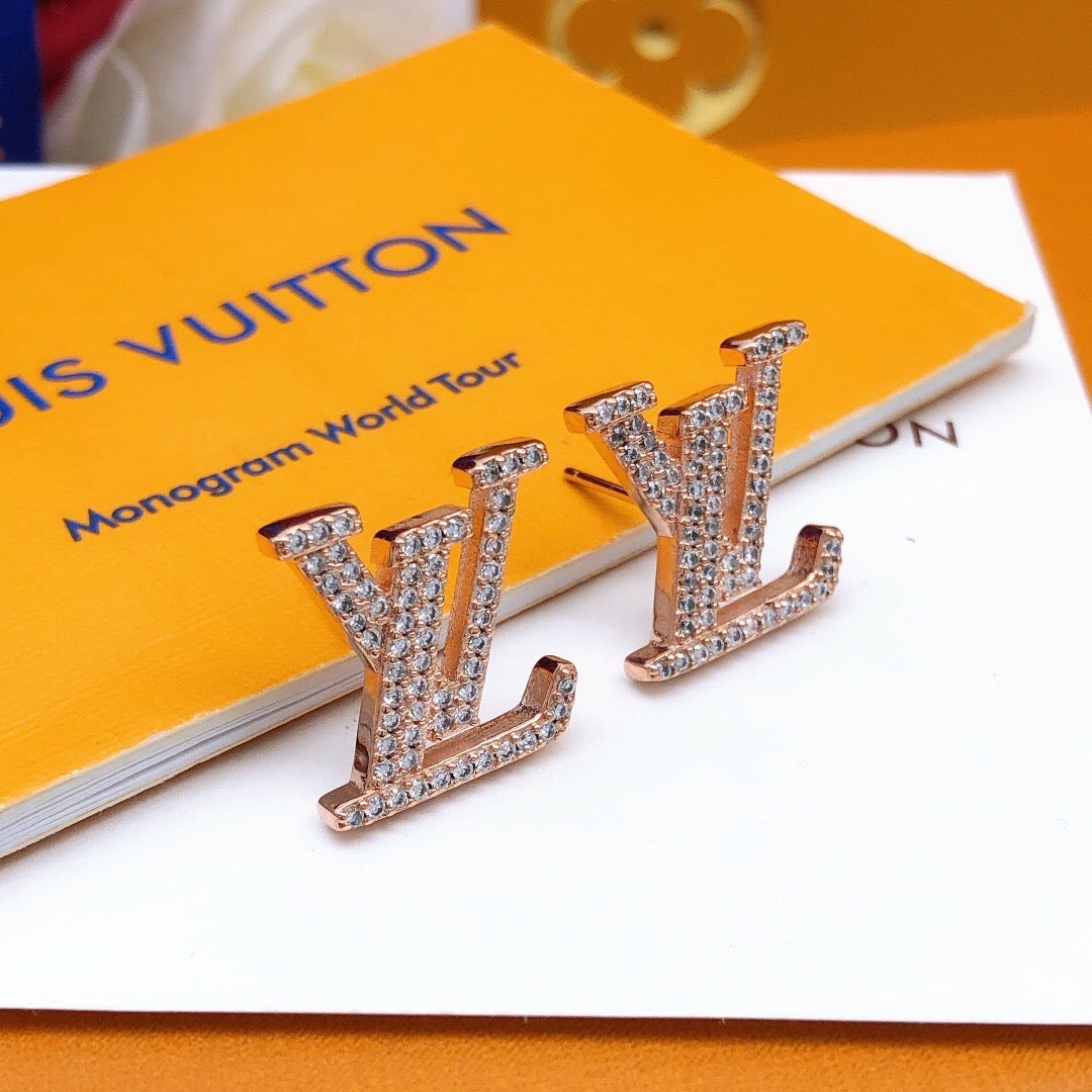Martin Graham stud earrings in polished metal-tone – detail view