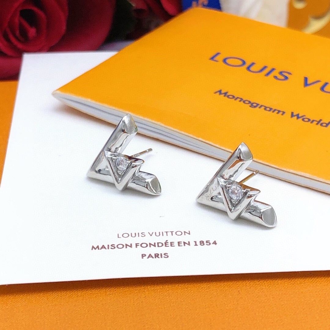 Martin Graham stud earrings in polished metal-tone – detail view