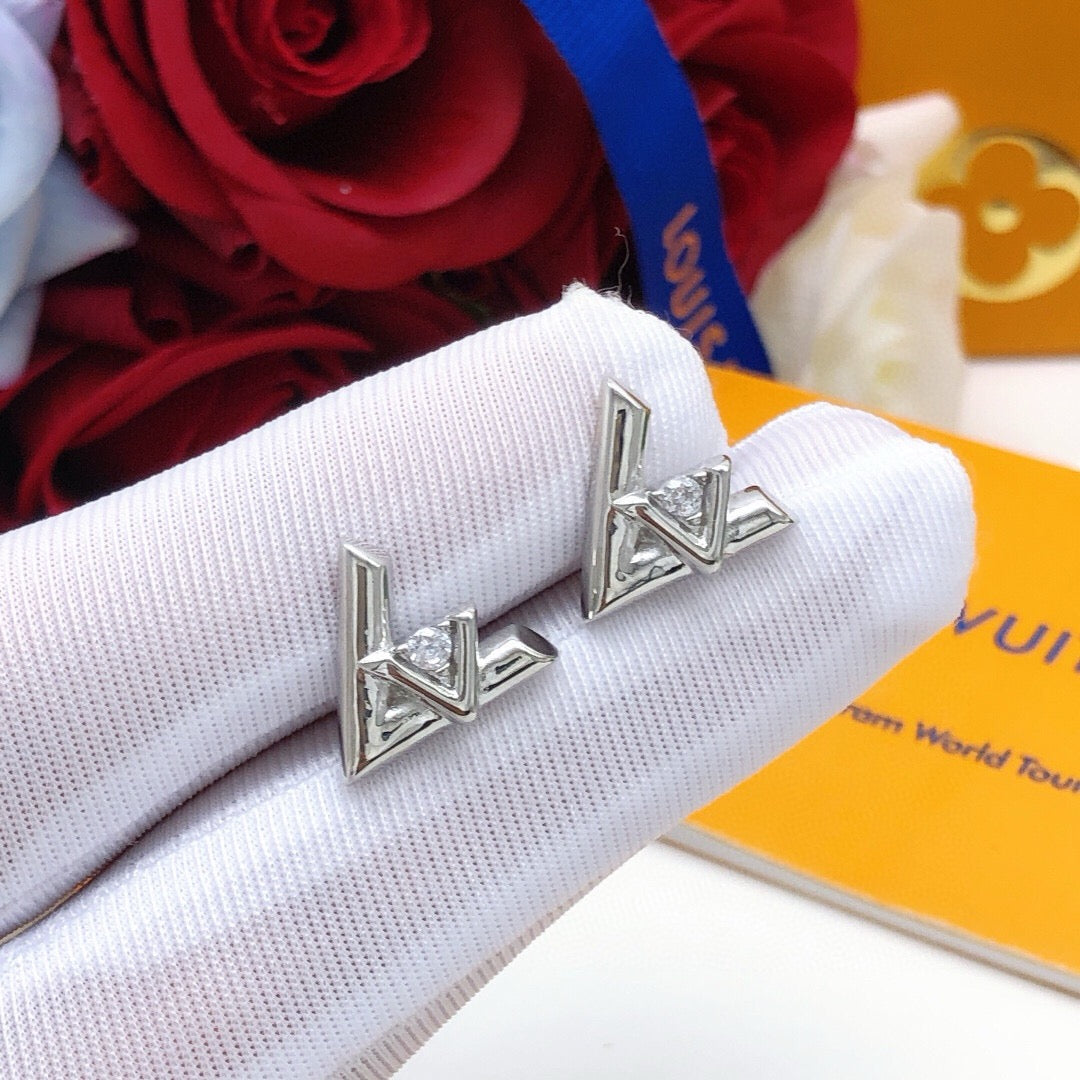 Martin Graham stud earrings in polished metal-tone – close-up detail