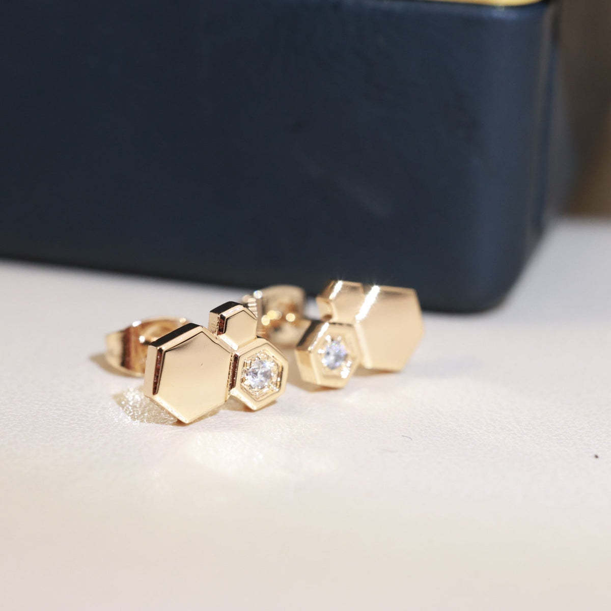 Martin Graham stud earrings in polished metal-tone – main product view