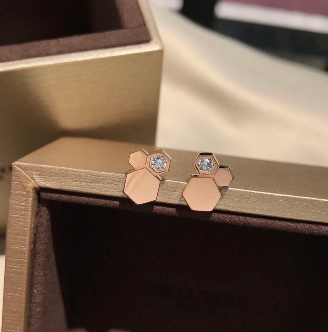Martin Graham stud earrings in polished metal-tone – detail view